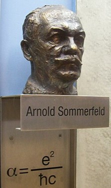 Bust of Arnold Sommerfeld with equation.